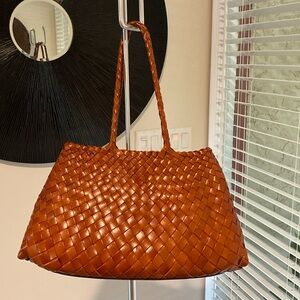 French style handmade cowhide leather woven shoulder tote bag as seen in Etsy.
